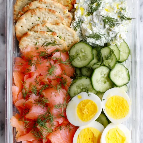 Bento box snacks featuring smoked salmon and cream cheese.