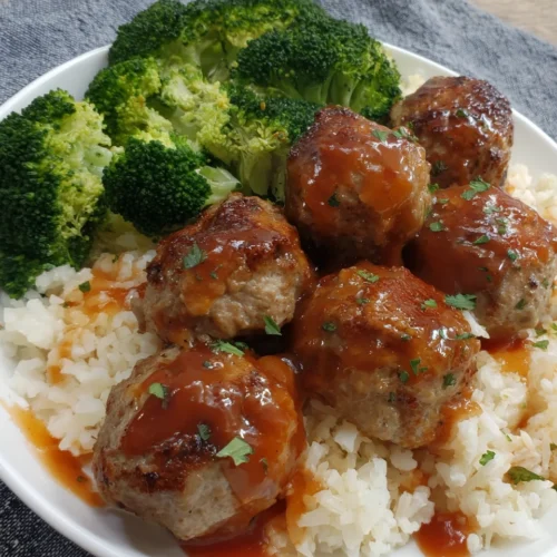 Delicious freezer meatballs with broccoli and rice.