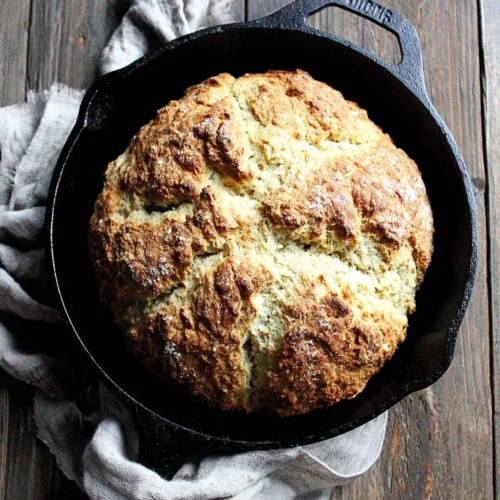 Delicious Irish soda bread in a cast iron skillet.