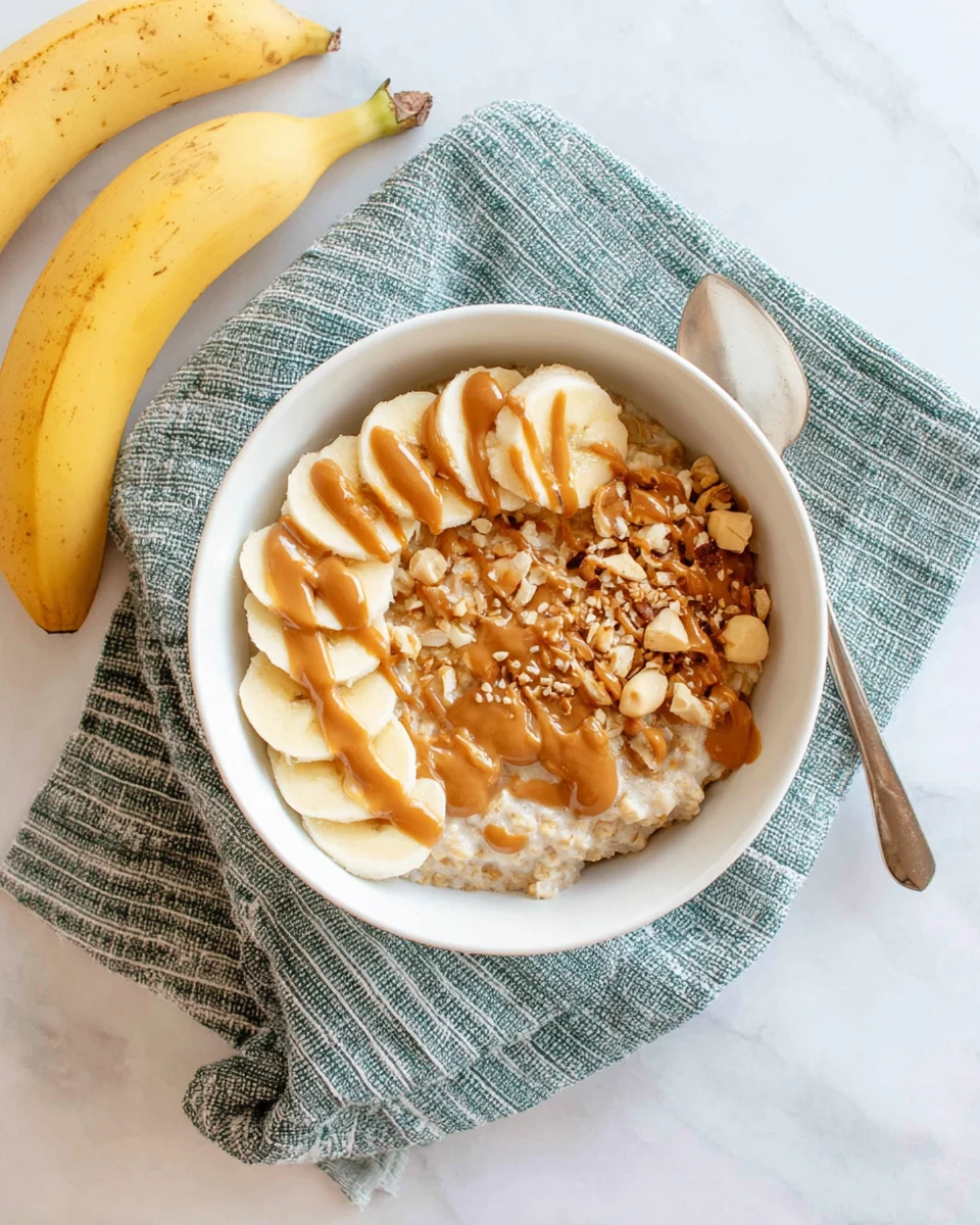Peanut Butter Banana Oatmeal Delight Delicious peanut butter banana oatmeal with sliced bananas.