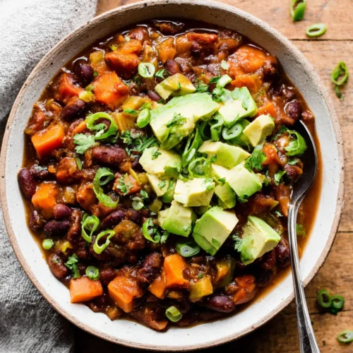 Delicious vegetarian chili recipe with sweet potatoes and beans.