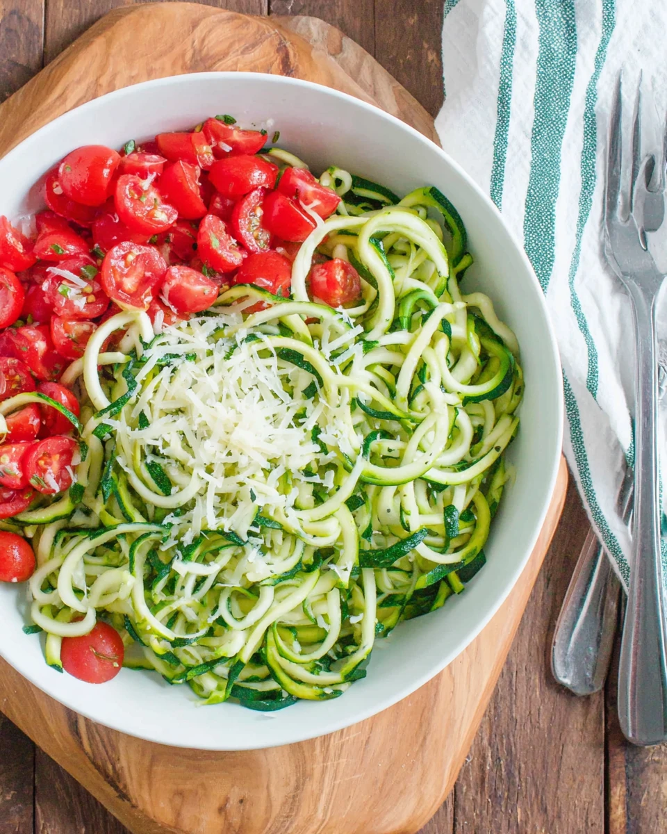 Zucchini noodles and fresh ingredients for a healthy recipe.