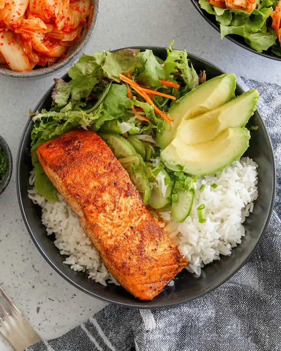 Air fryer frozen salmon served with rice and vegetables.