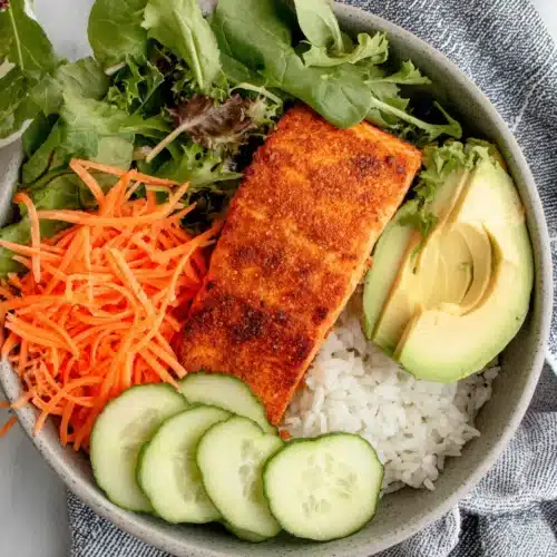 Delicious air fryer frozen salmon meal with veggies and rice.