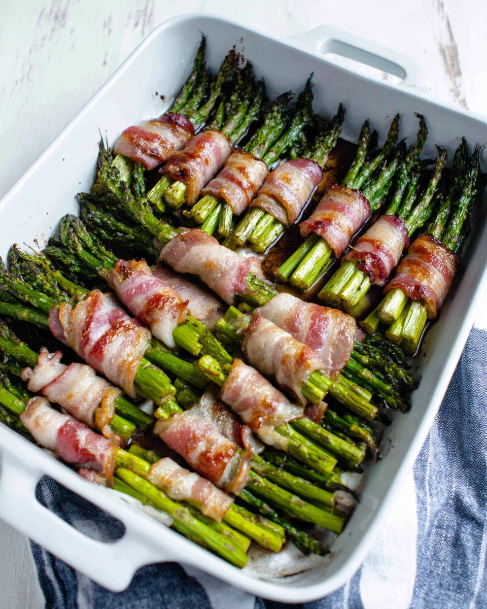 Savory bacon-wrapped asparagus bundles ready to bake.