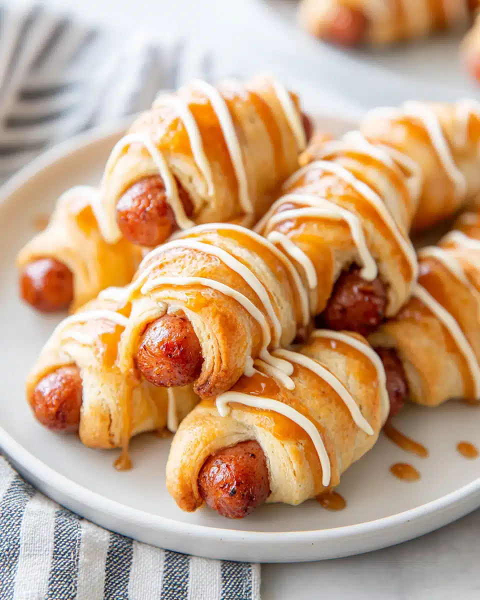 Breakfast Pigs in a Blanket Recipe Delicious breakfast pigs in a blanket with maple glaze.