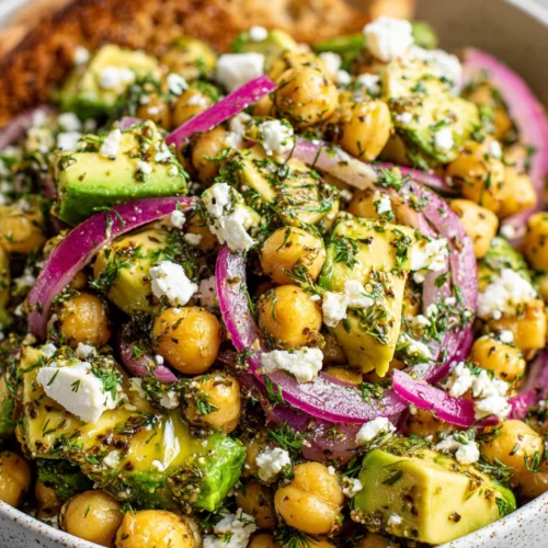 Chickpea salad with avocado, feta, and herbs.