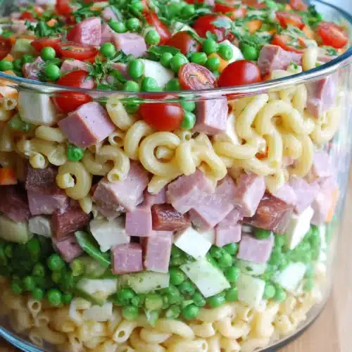 Delicious layered pasta salad perfect for gatherings.