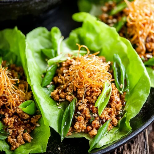 Healthy lettuce wraps with ground chicken and rice noodles.