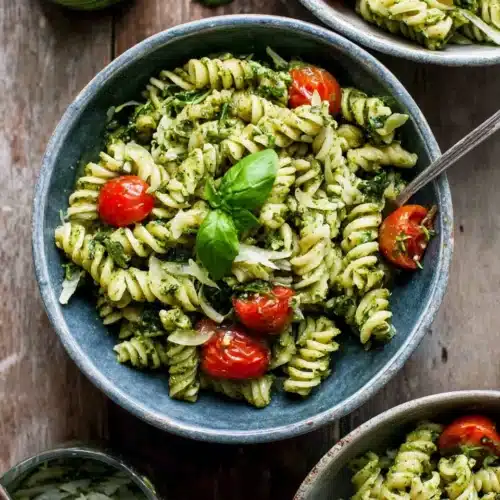 Pesto Pasta Salad: A Refreshingly Delicious Delight 1 Delicious pesto pasta salad with cherry tomatoes and basil.