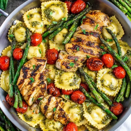 Pesto ravioli with chicken and vegetables for a quick dinner.