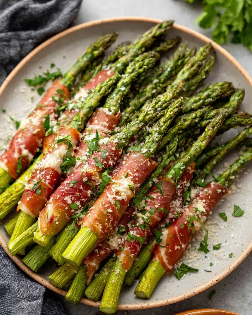 Delicious prosciutto wrapped asparagus, a healthy snack option.