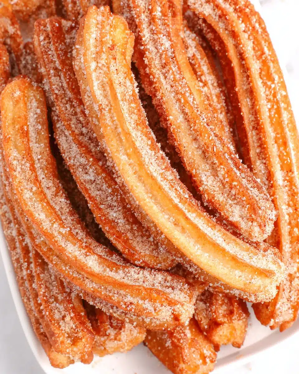 Delicious authentic churros covered in cinnamon sugar.