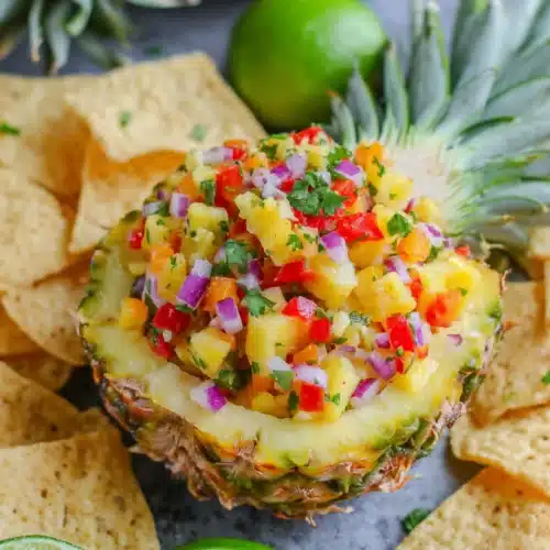 Pineapple salsa served in a pineapple bowl for Cinco de Mayo.