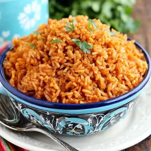 Delicious easy Spanish rice served in a colorful bowl.