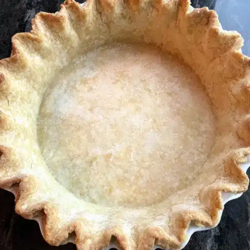Homemade Lemon Meringue Pie: A Delightfully Tangy Treat 1 Homemade lemon meringue pie crust ready for filling.