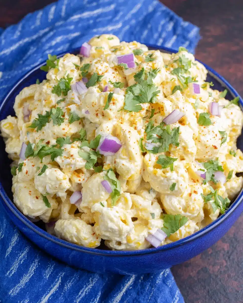 Delicious Mexican street corn pasta salad in a blue bowl.