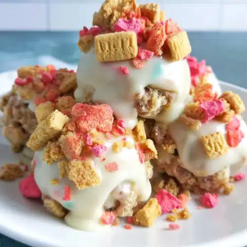 Strawberry crunch cookie balls with creamy center and crunchy topping