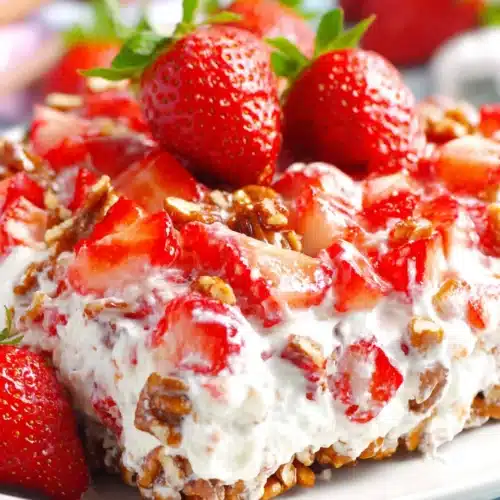 Strawberry pecan pretzel salad with fresh strawberries and creamy filling
