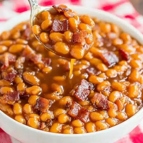 Best Baked Beans with Bacon and Brown Sugar: A Delicious Delight 1 Best baked beans with bacon and brown sugar in a white bowl on a checkered cloth