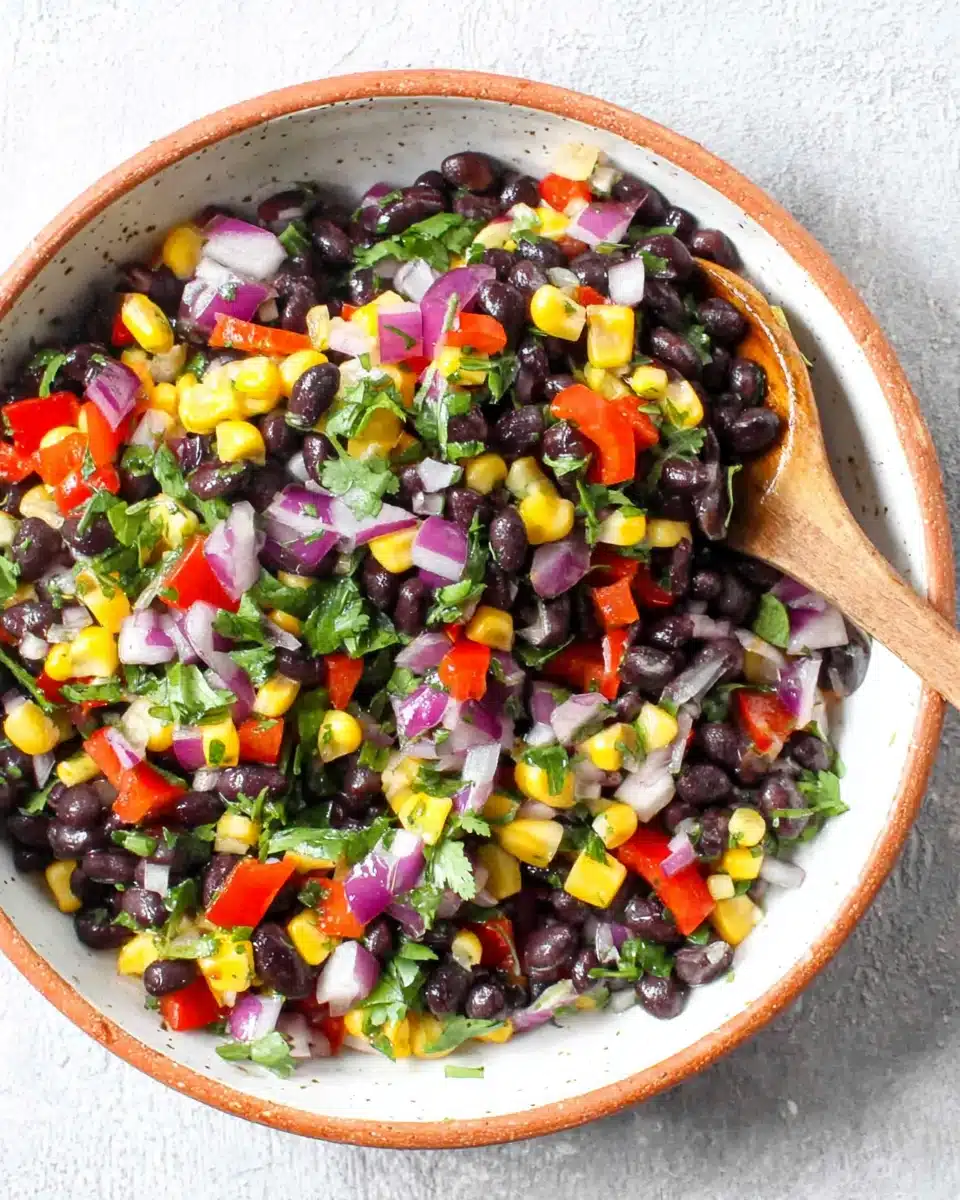 Black bean and corn salad with red pepper, corn, cilantro, and lime in a bowl