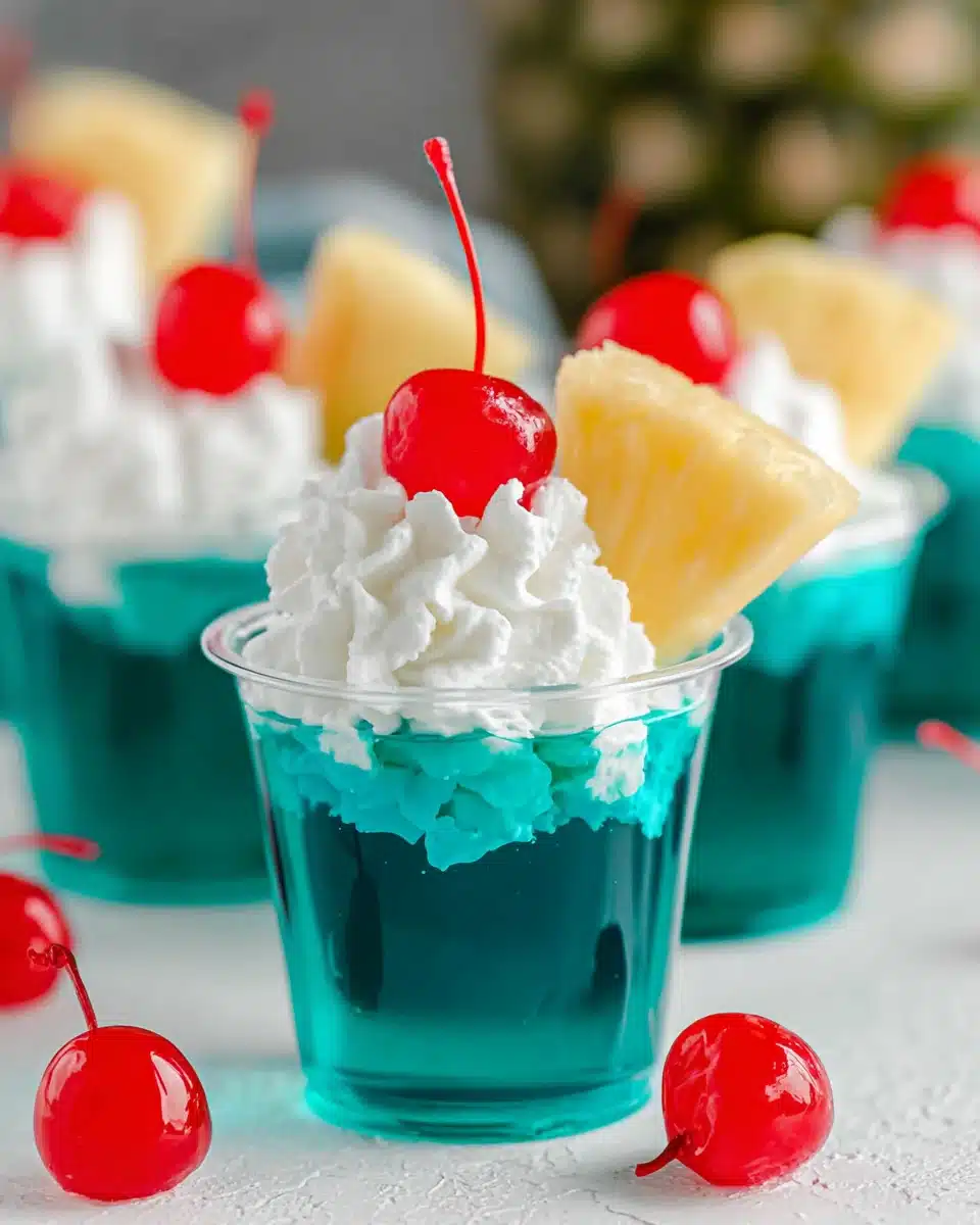 Blue Hawaiian Jello Shots with Pineapple and Cherry Blue Hawaiian jello shots with pineapple and cherry garnish