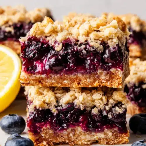 Blueberry oatmeal bars with crumble topping and fresh blueberries
