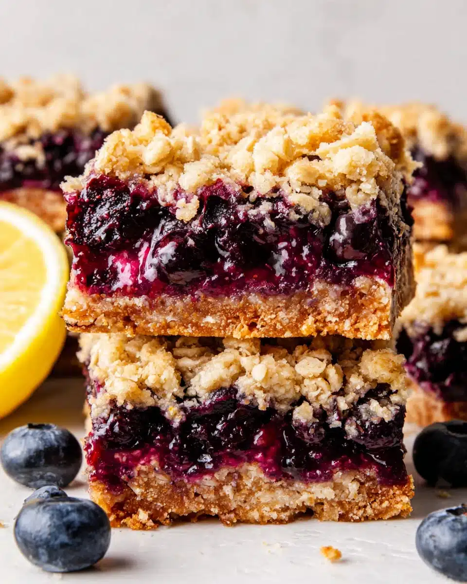 Blueberry oatmeal bars with crumble topping and fresh blueberries