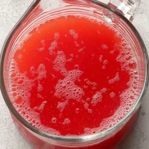 Canning Watermelon Lemonade Concentrate: A Refreshing Treat 1 Canning watermelon lemonade concentrate in a glass jug with bubbles