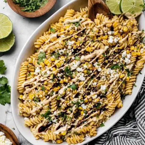 Mexican elote street corn pasta salad with corn, cheese, and lime