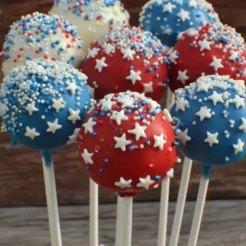 Red, white, and blue patriotic cake pops with star shapes and sprinkles