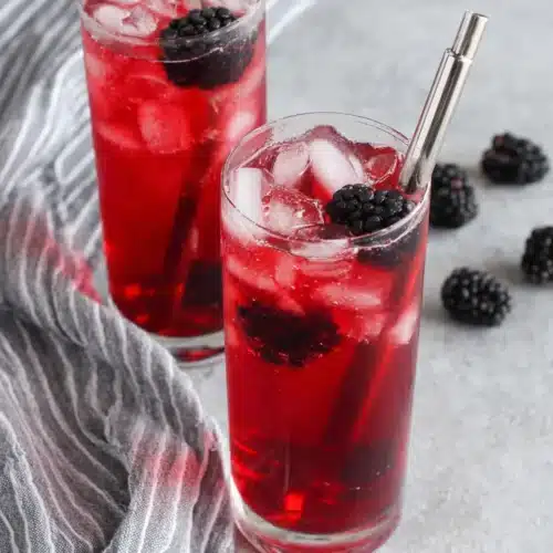 Starbucks Very Berry Hibiscus Refresher: Refreshing Delight 1 Starbucks Very Berry Hibiscus Refresher with blackberries and ice in a glass