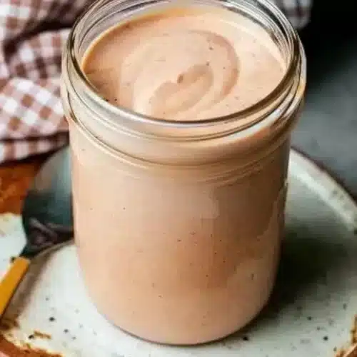 BBQ Ranch Dressing: A Delicious and Easy Dip 1 Creamy BBQ ranch dressing in a glass jar, perfect for dipping and drizzling