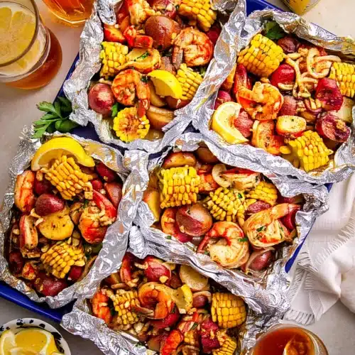 Cajun shrimp boil foil packs with shrimp, corn, potatoes, and sausage