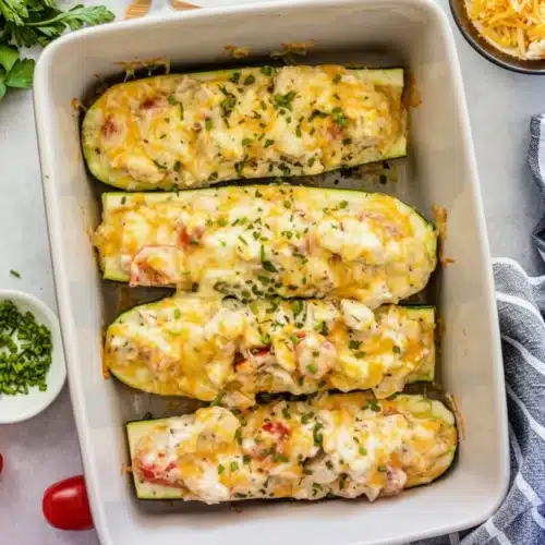 Canned chicken and zucchini boats with melted cheese and herbs