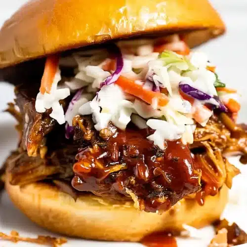 Easy instant pot BBQ pulled pork burger with coleslaw on a brioche bun