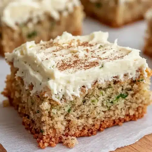 Moist pineapple zucchini cake with cream cheese frosting and cinnamon topping