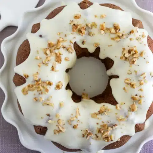 Zucchini bread bundt cake with cream cheese glaze and walnuts