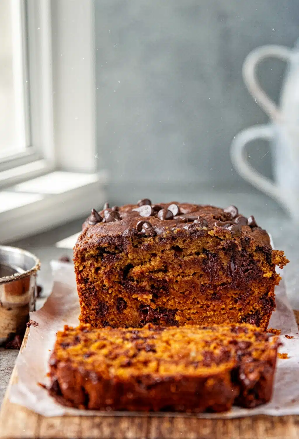 Best Chocolate Chip Pumpkin Bread with Chocolate Chips Moist best chocolate chip pumpkin bread with chocolate chips, sliced on parchment paper