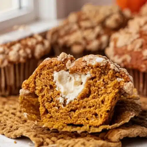 Cheesecake Stuffed Pumpkin Cookies: Irresistibly Delicious Treats 1 Cheesecake stuffed pumpkin cookie with creamy filling, golden-brown exterior, autumn dessert