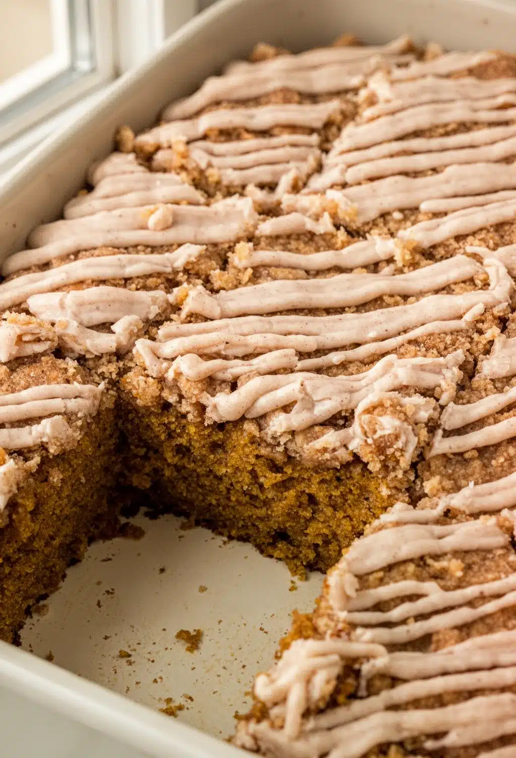 Cinnamon Streusel Pumpkin Cake with Icing Drizzle Moist cinnamon streusel pumpkin cake with crumbly topping and white icing drizzle