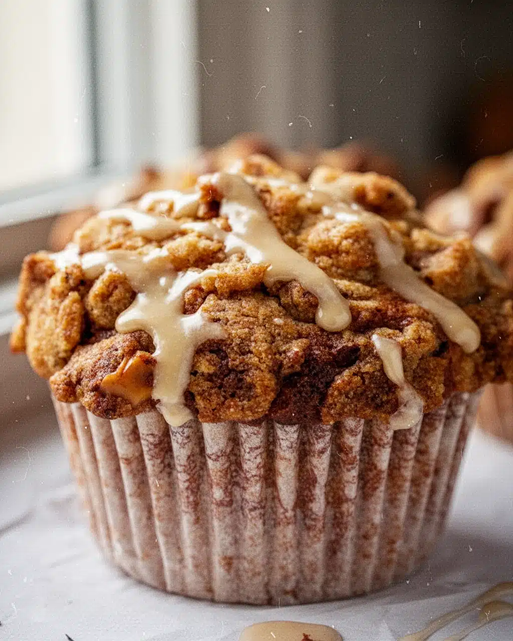 Fall Flavor Muffin with Maple Streusel and Glaze Fall flavor muffin with maple streusel and glaze, golden brown, crispy topping